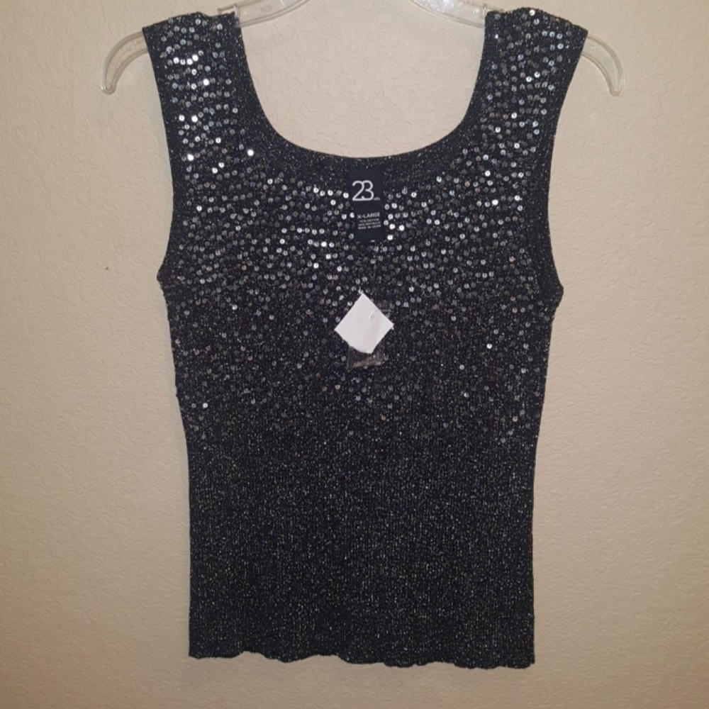 Sleeveless blouse with silver sequins.